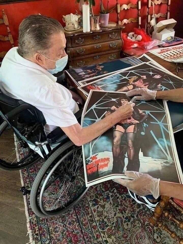 Tim Curry signing autographs for The Rocky Horror Picture Show