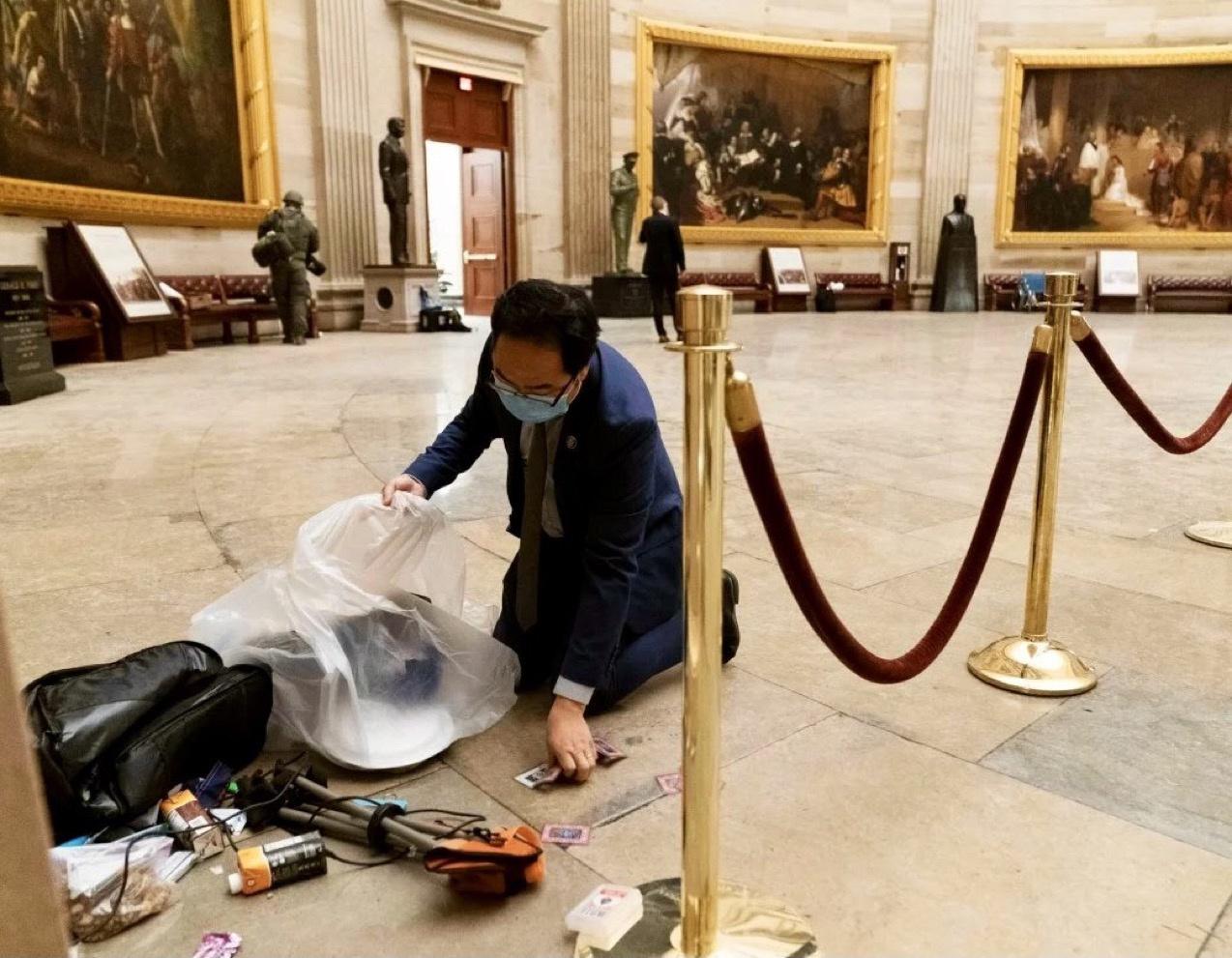Congressman Andy Kim on Jan. 7, 2021, cleaning debris from the attack on the Capital
