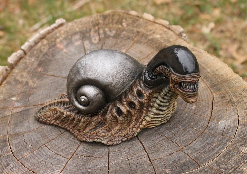Realistic xenomorph snail sculpture