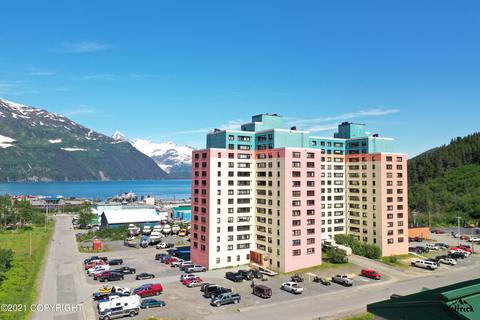 Wittier, Alaska. The whole town lives in this building, its their city. Their grocery store, gym, police station, post office, school, mayor's office etc... is also in this building. You can only get there by sea or a one&nbsp;way tunnel.