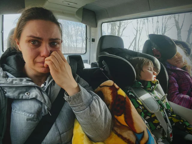 Ukrainian woman brings her children and parents to leave Ukraine. She was not able to say a Goodbye to her husband.