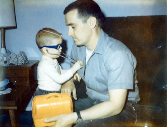 Me, doctoring my very patient Dad back in the late 60s. 20 years later he would develop Parkinson&rsquo;s disease and it still hurts that I could not doctor him then.