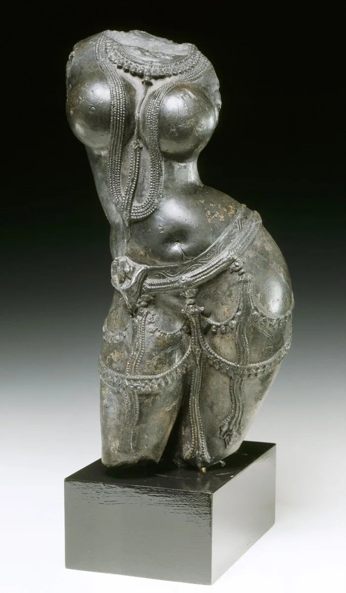 A 9th century sculpture of a female torso carved in black chlorite. Geography: Rajasthan, India. Now on display at the victoria and albert museum in London